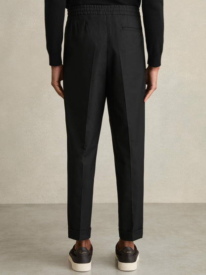 Reiss Relaxed-Fit Pleated Tapered Trousers in Black